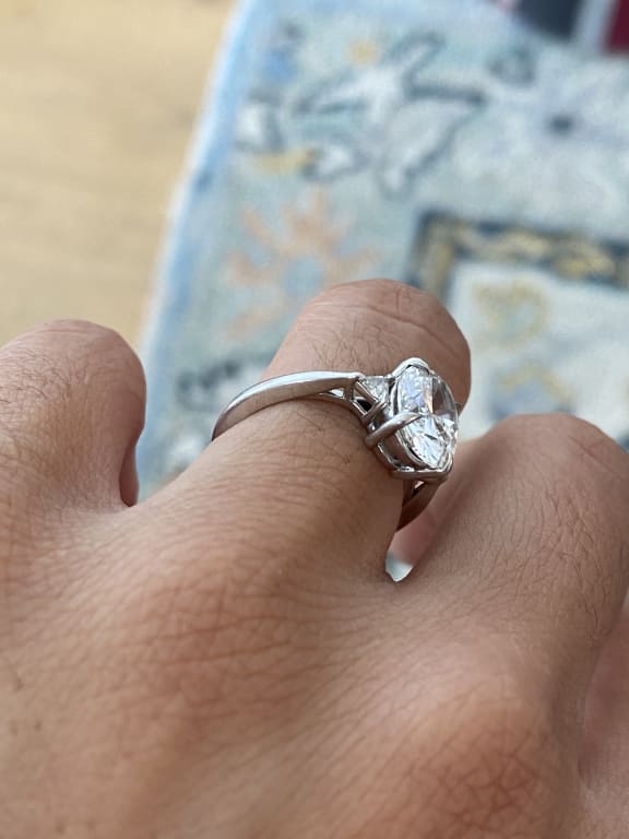 Oval diamond ring on hand