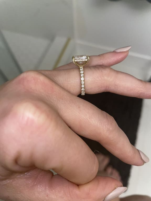 Oval diamond ring on hand