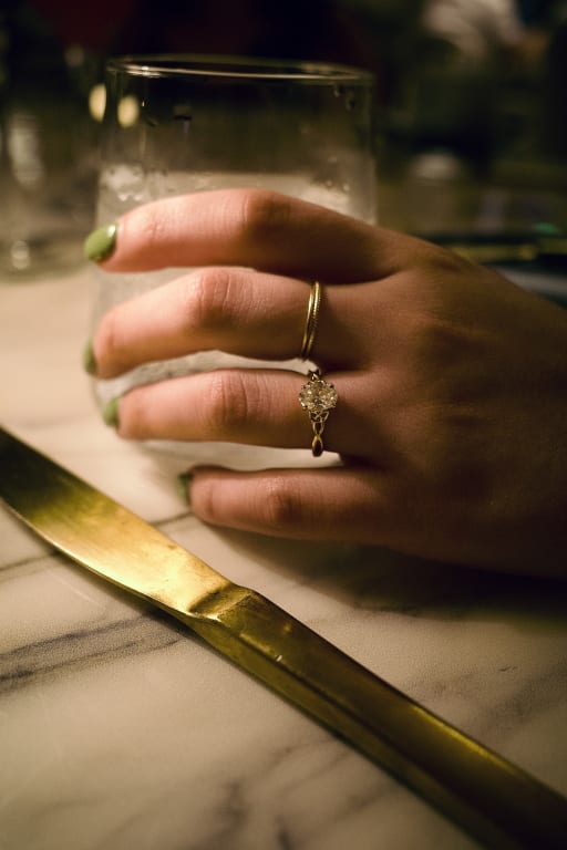 Oval diamond ring on hand