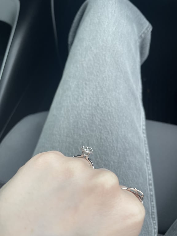 Oval diamond ring on hand