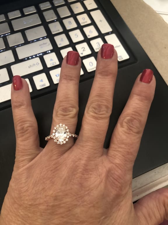 Oval diamond ring on hand