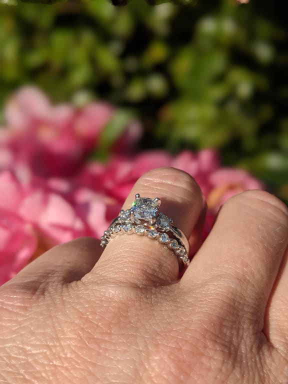 Oval diamond ring on hand