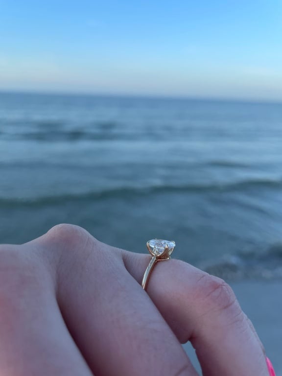 Oval diamond ring on hand