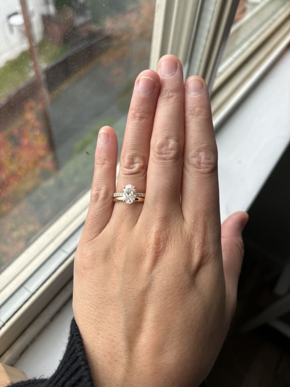 Oval diamond ring on hand
