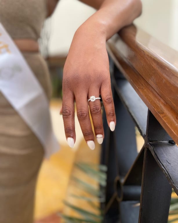 Oval diamond ring on hand