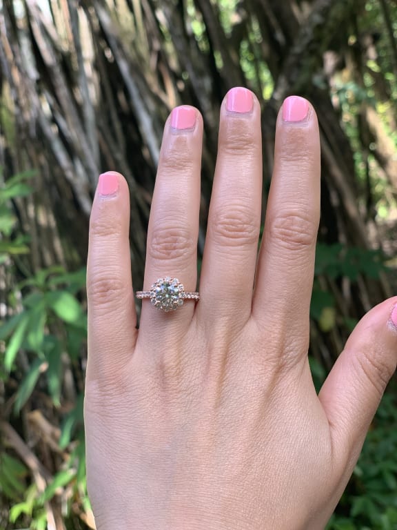 Oval diamond ring on hand