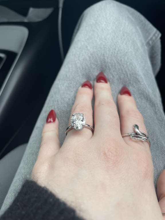 Oval diamond ring on hand