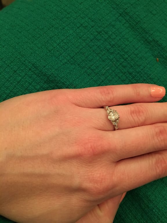 Oval diamond ring on hand