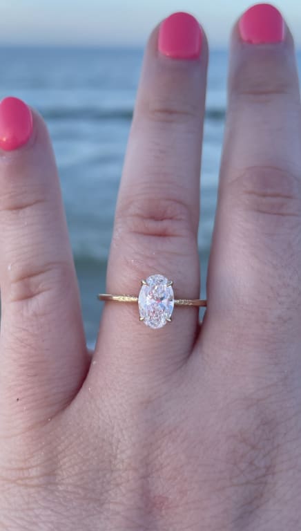 Oval diamond ring on hand