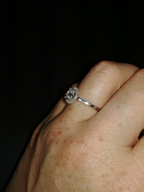 Oval diamond ring on hand