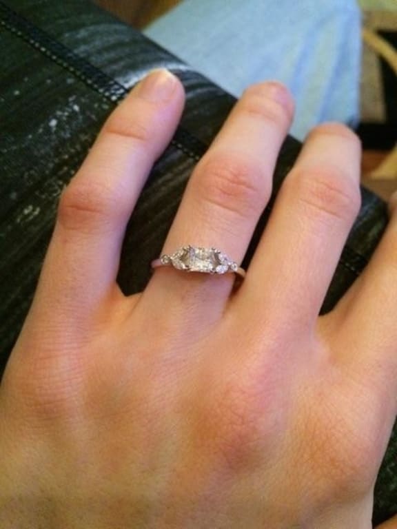 Oval diamond ring on hand