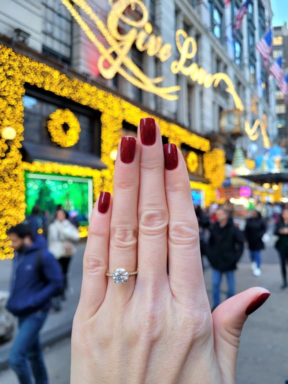 Oval diamond ring on hand