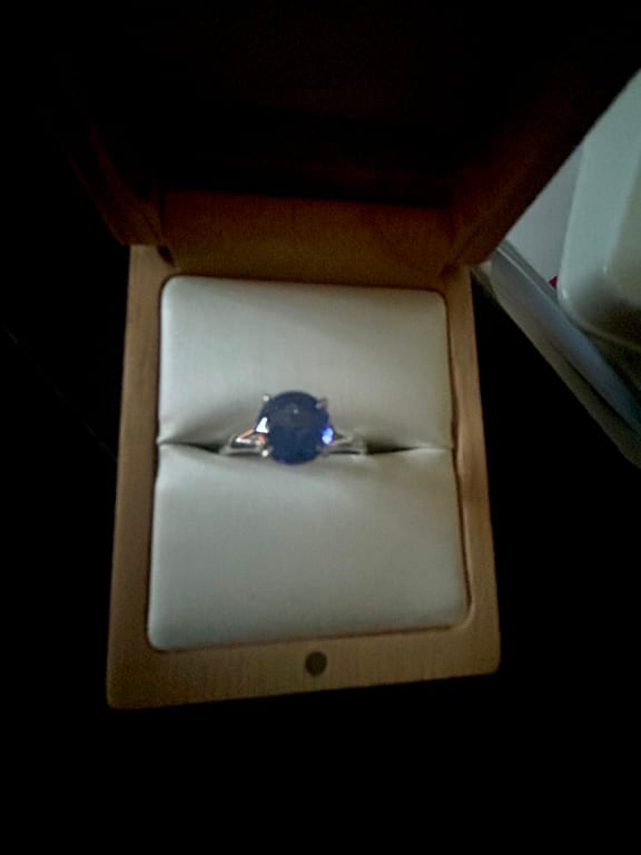 Oval diamond ring on hand