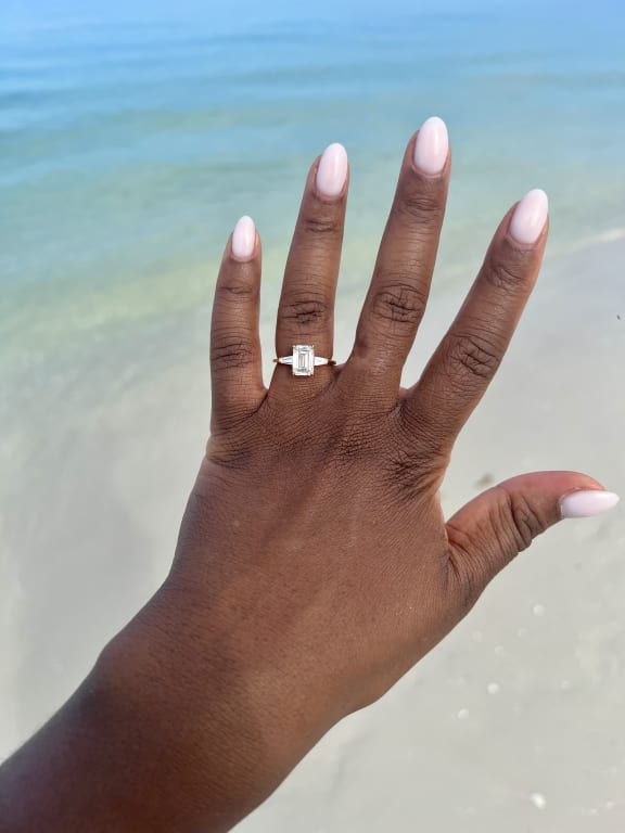 Oval diamond ring on hand