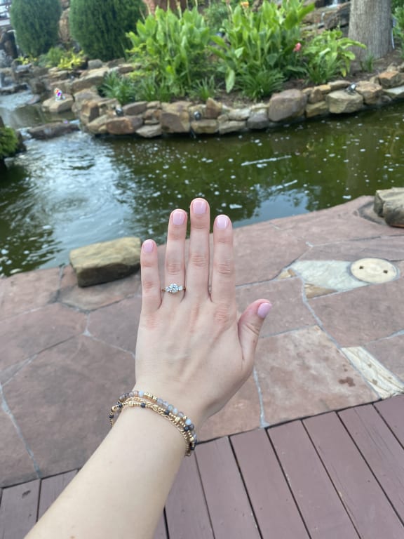 Oval diamond ring on hand