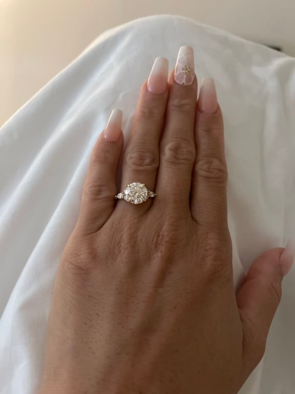 Oval diamond ring on hand