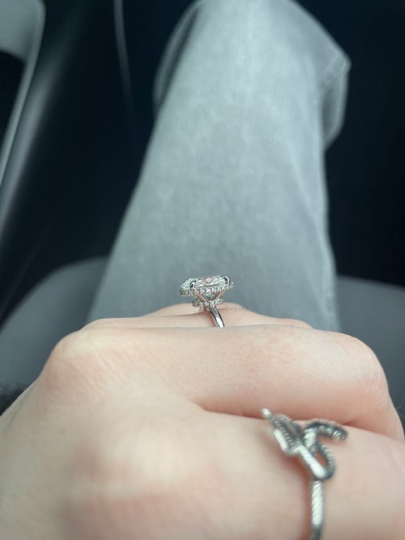 Oval diamond ring on hand