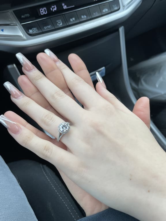 Oval diamond ring on hand