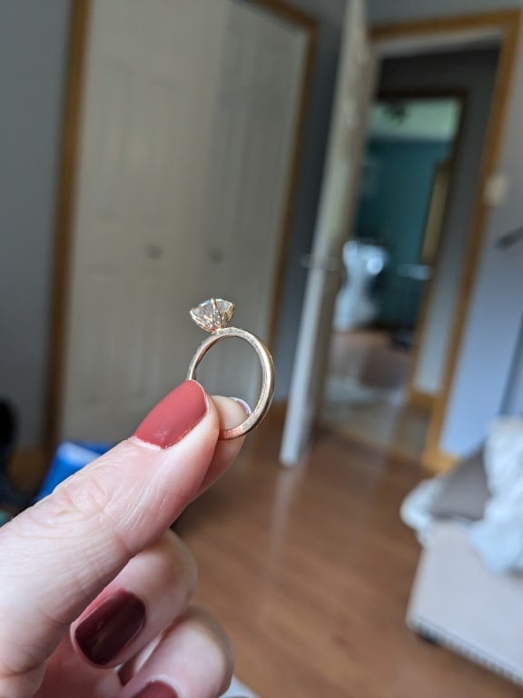 Oval diamond ring on hand