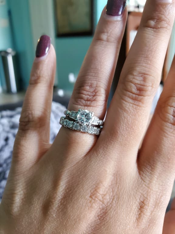 Oval diamond ring on hand