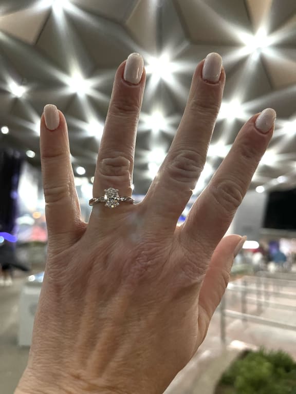 Oval diamond ring on hand