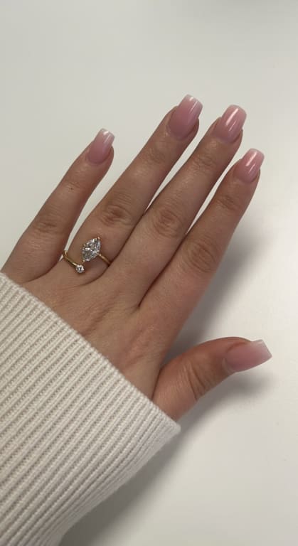Oval diamond ring on hand