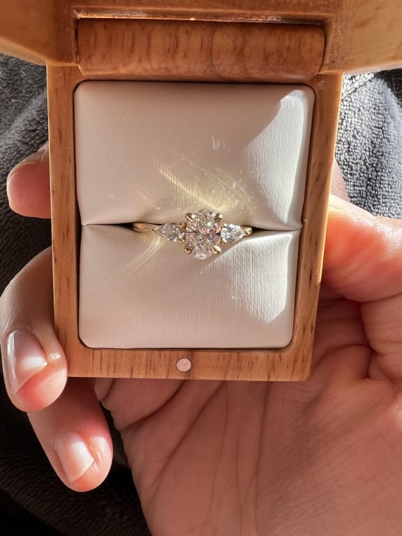Oval diamond ring on hand