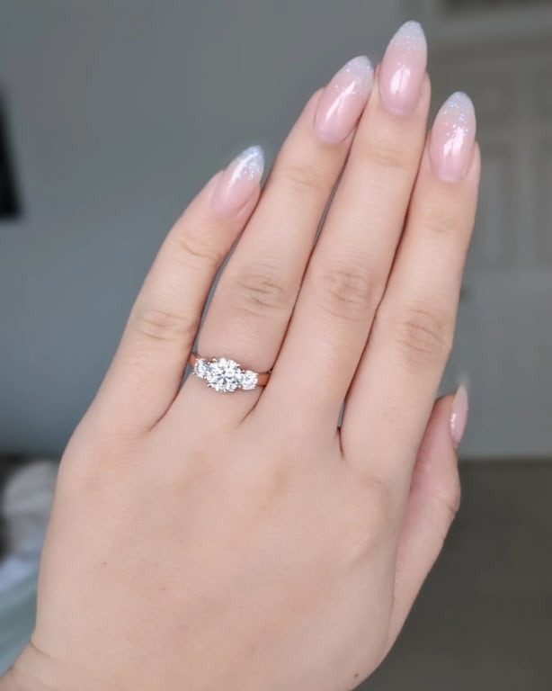 Oval diamond ring on hand