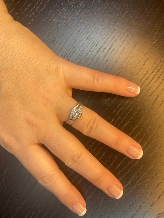 Oval diamond ring on hand