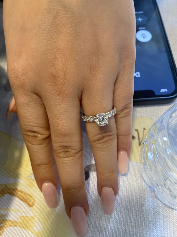 Oval diamond ring on hand