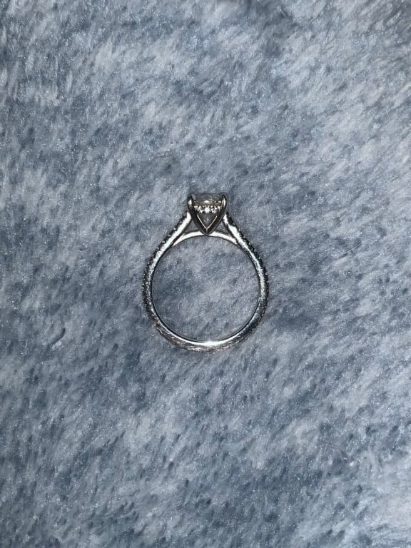 Oval diamond ring on hand