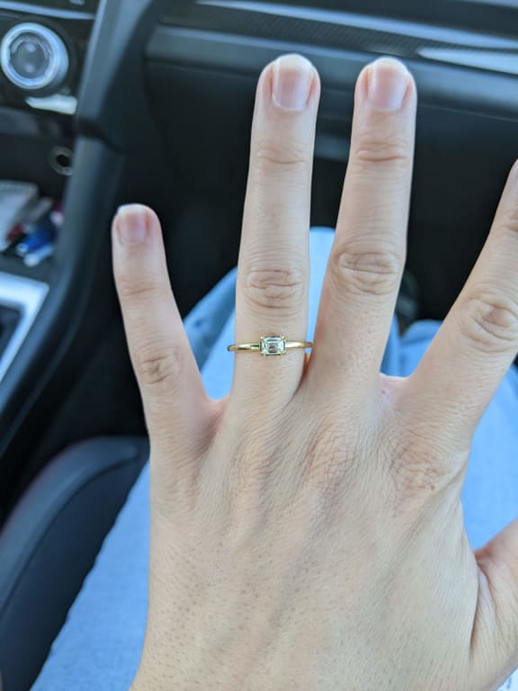 Oval diamond ring on hand