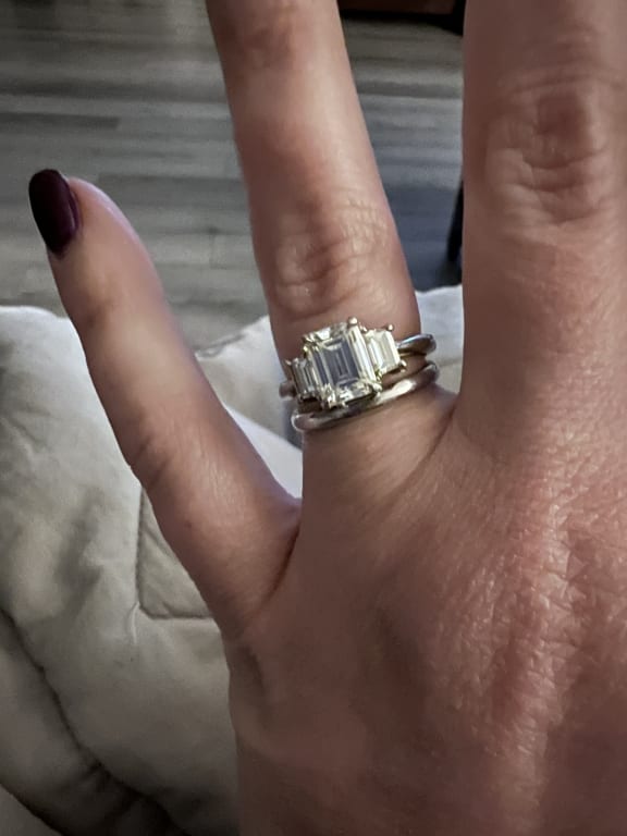 Oval diamond ring on hand