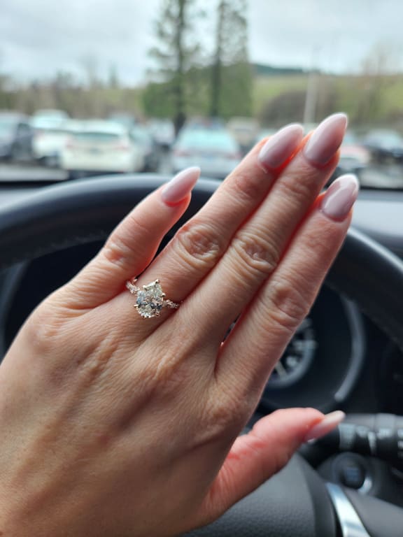 Oval diamond ring on hand