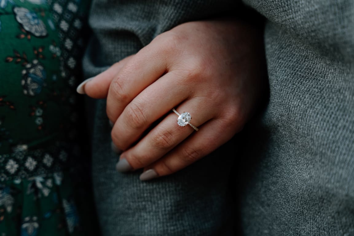 Oval diamond ring on hand