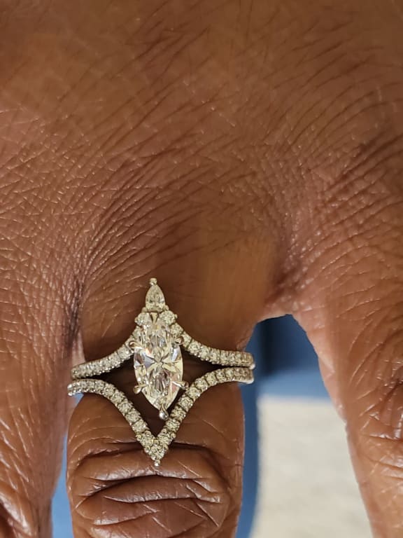 Oval diamond ring on hand