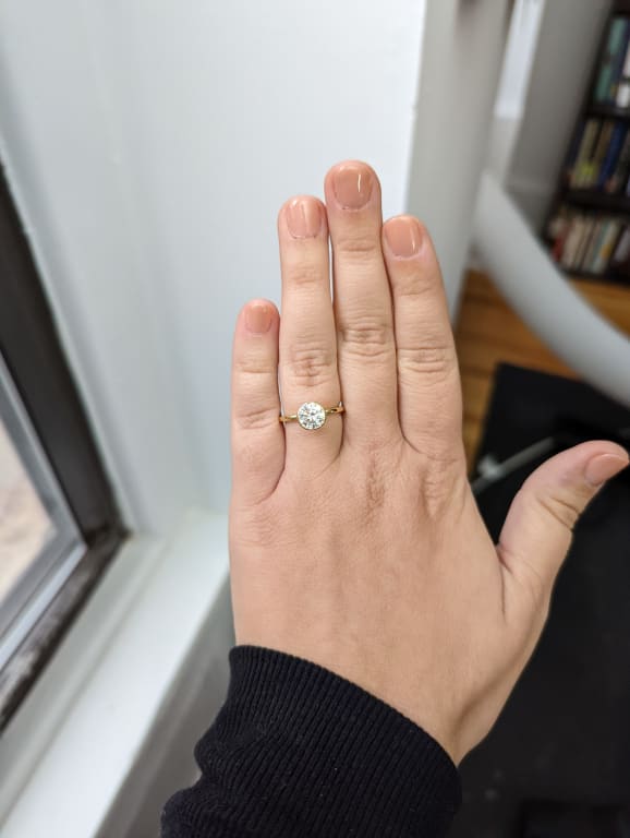 Oval diamond ring on hand
