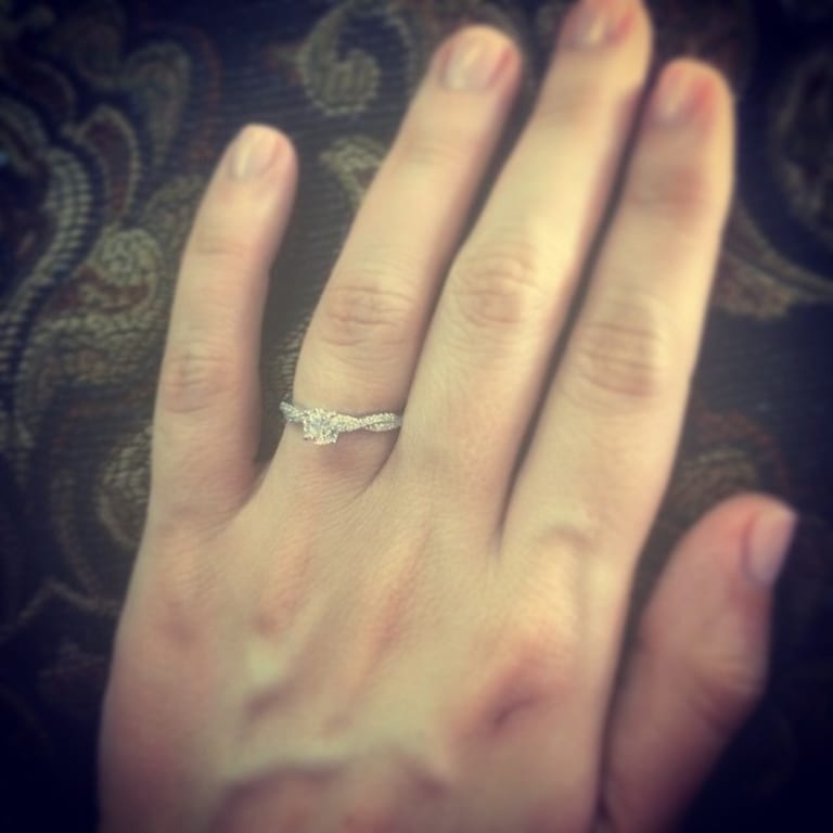 Oval diamond ring on hand