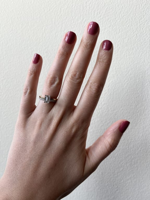 Oval diamond ring on hand
