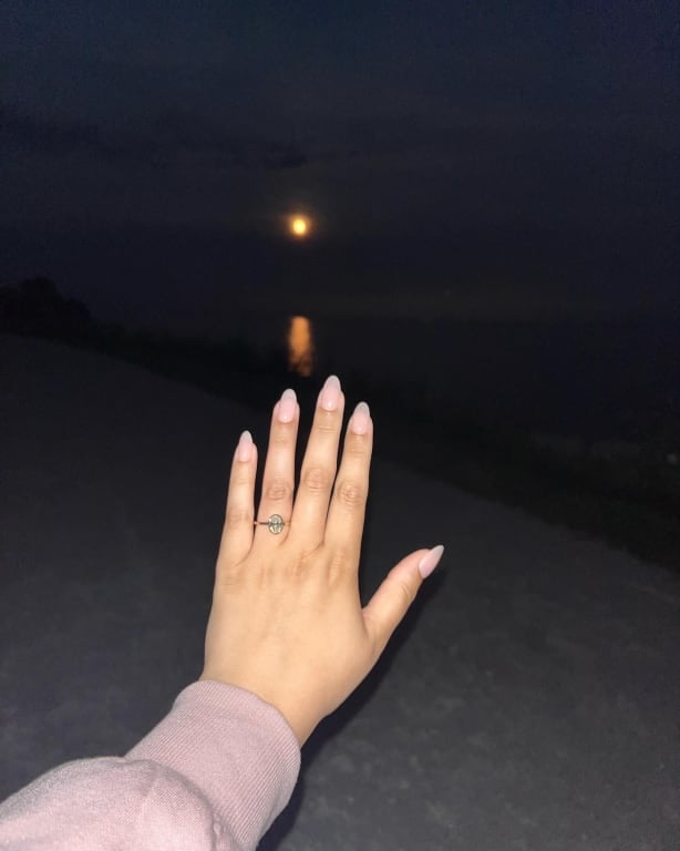 Oval diamond ring on hand
