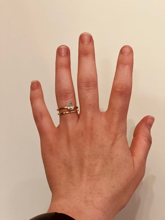 Oval diamond ring on hand