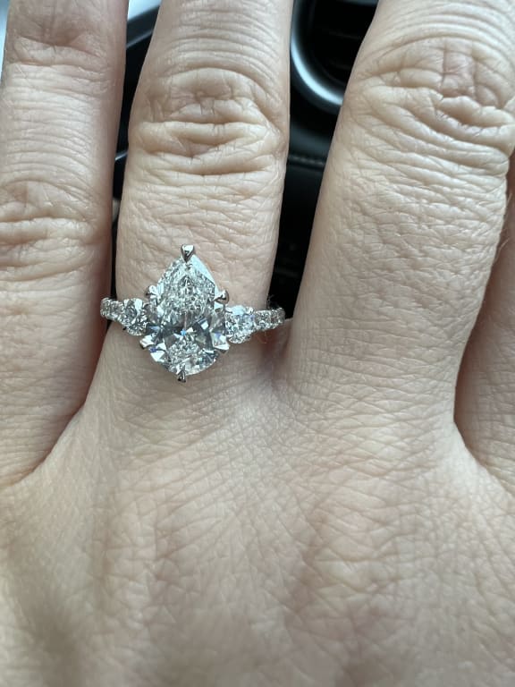 Oval diamond ring on hand