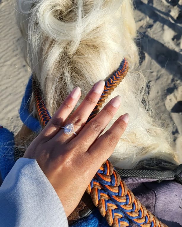 Oval diamond ring on hand