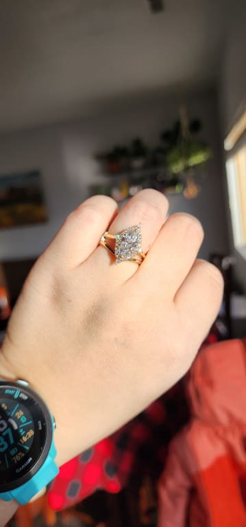 Oval diamond ring on hand