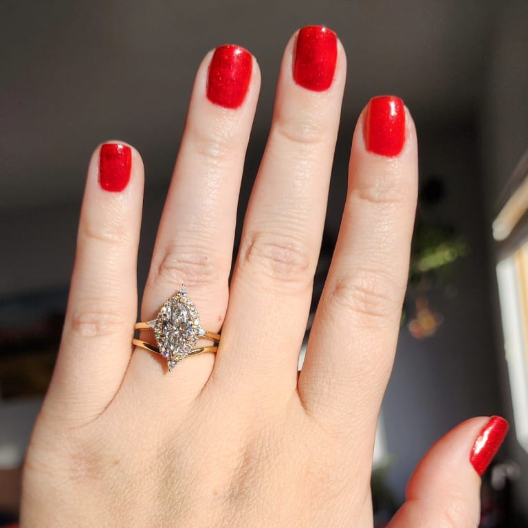 Oval diamond ring on hand