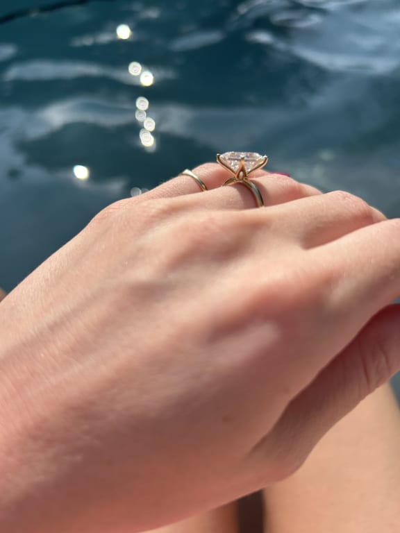 Oval diamond ring on hand