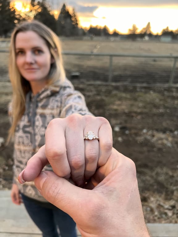 Oval diamond ring on hand