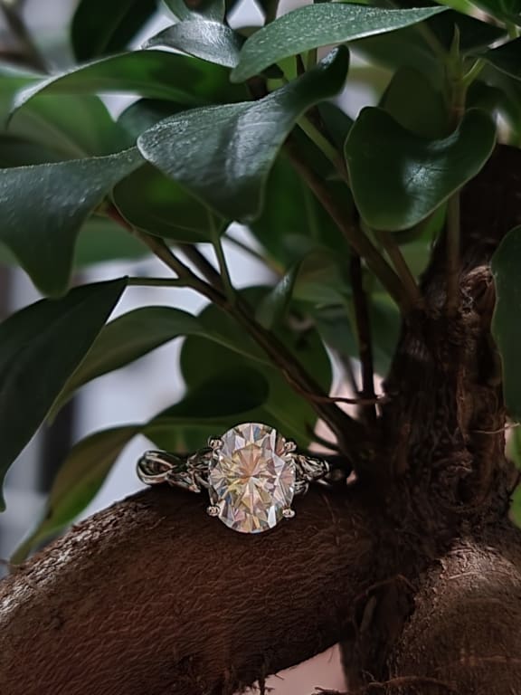 Oval diamond ring on hand