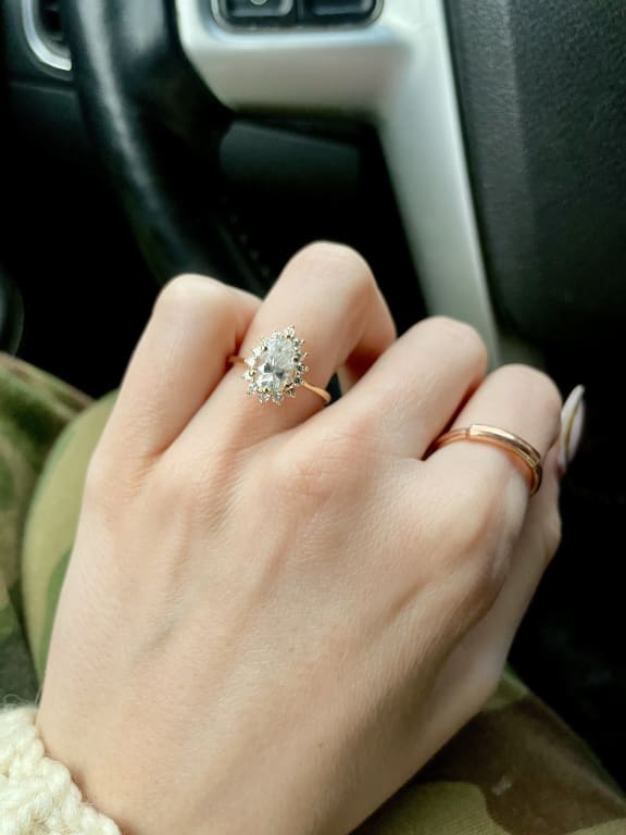 Oval diamond ring on hand