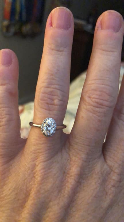 Oval diamond ring on hand
